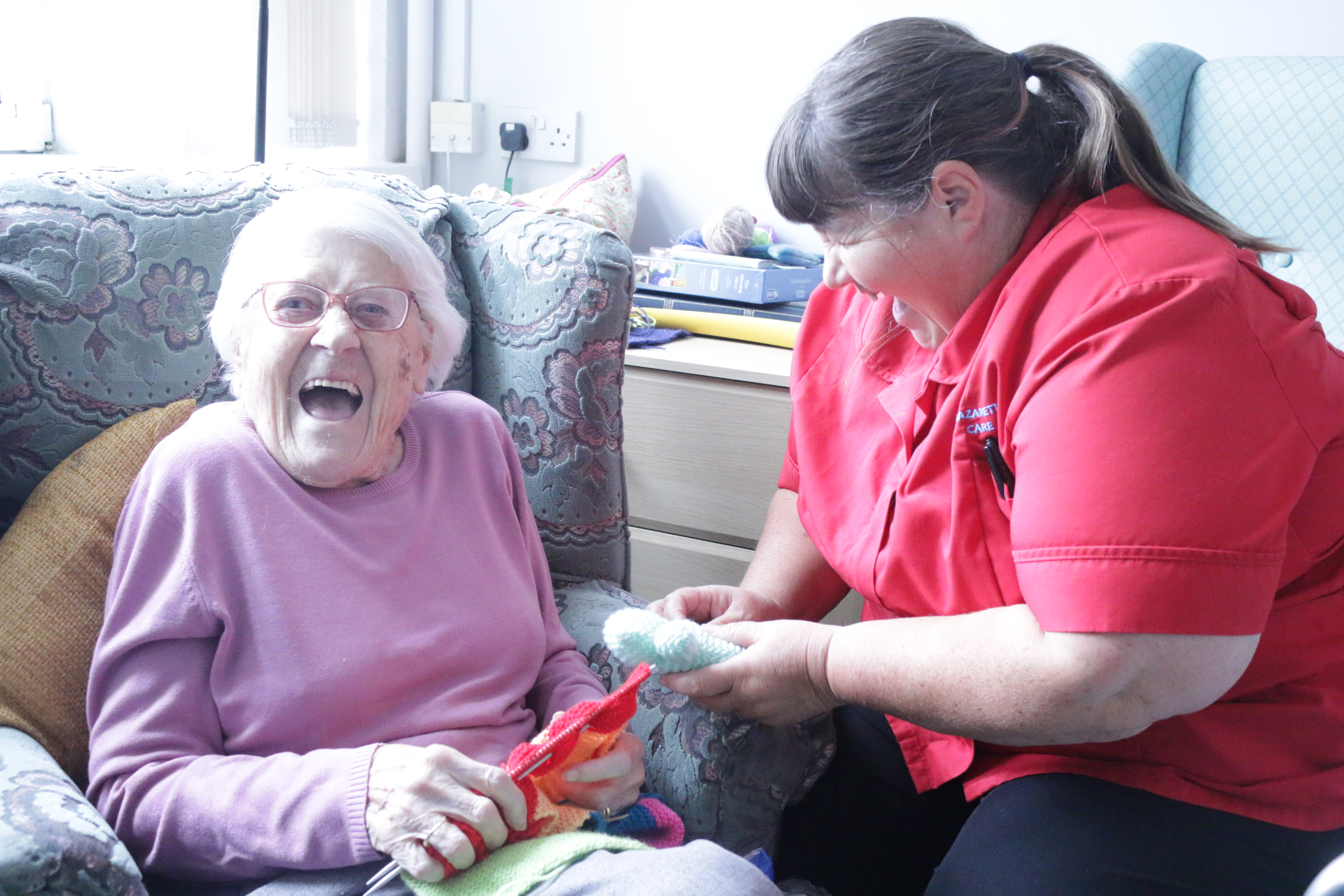 patient with nurse laughing