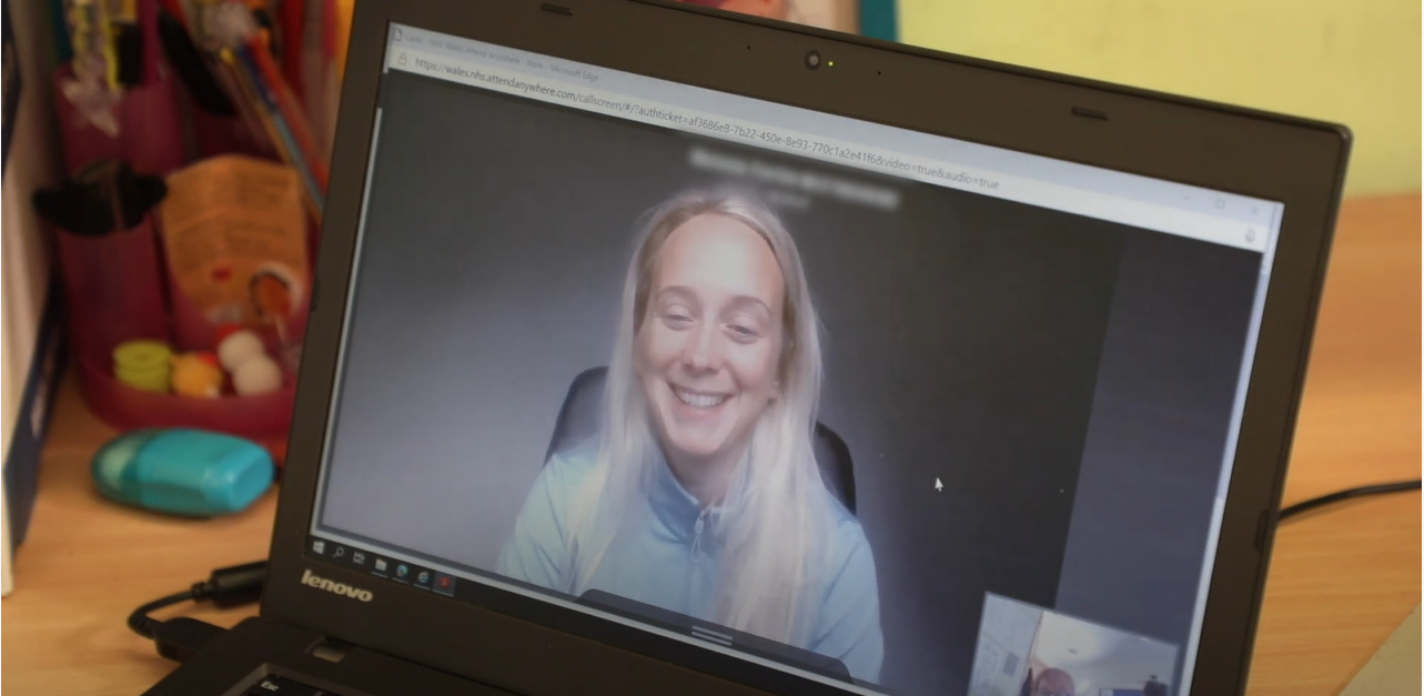 woman on video call, smiling