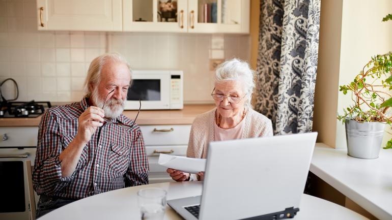 elderly couple at computer