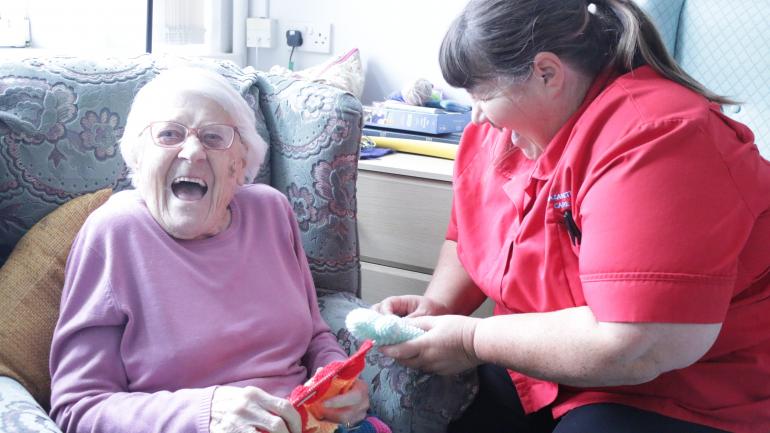 patient with nurse laughing