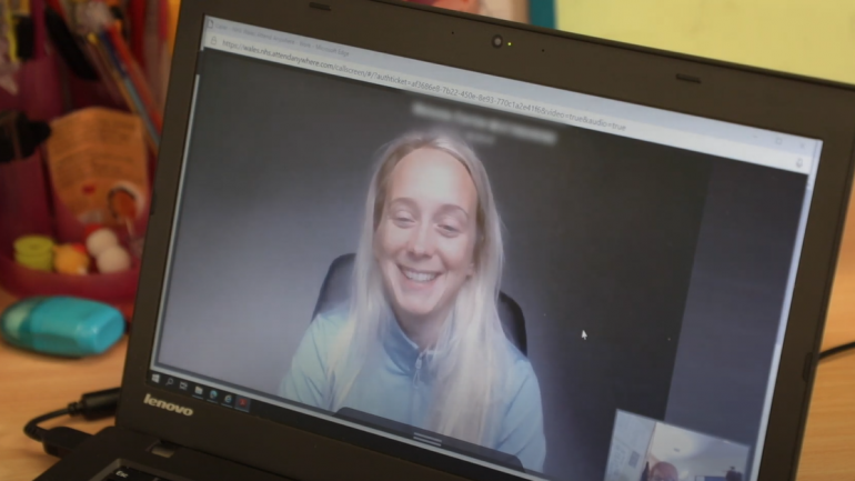 woman on video call, smiling